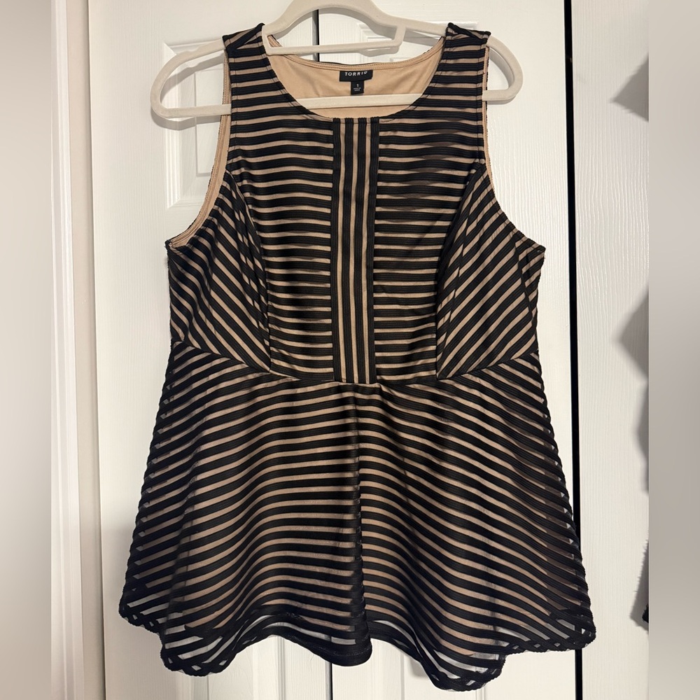 Stunning black and nude peplum tank.  Like new!